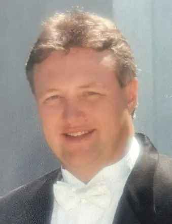 Dennis M Treu